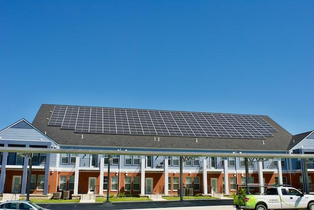 House and parking lot with solar panels